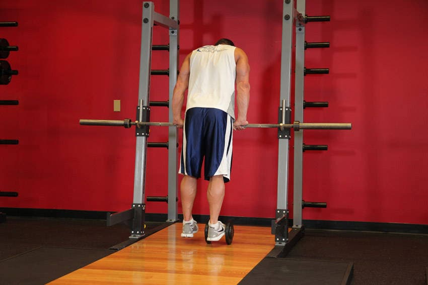 Calf Raise On A Dumbbell — starting position