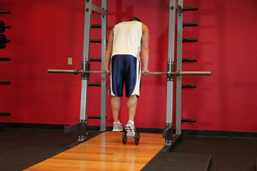 Calf Raise On A Dumbbell — end position
