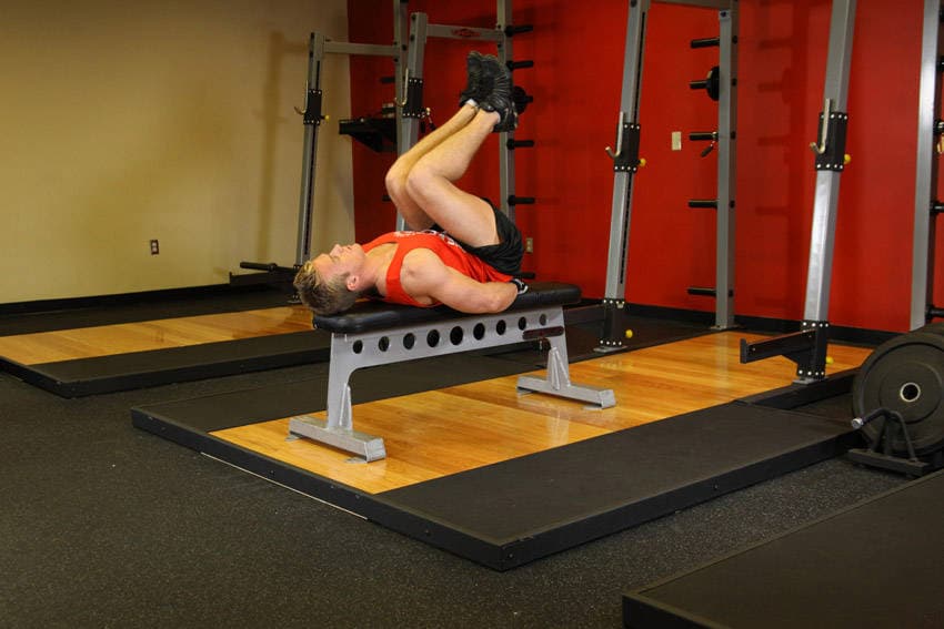 Flat Bench Leg Pull-In — starting position