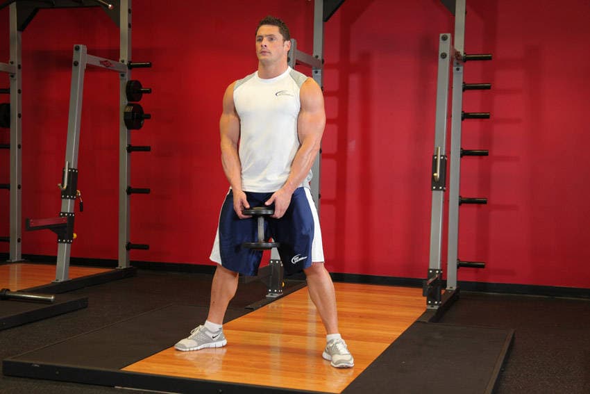 Plie Dumbbell Squat — starting position
