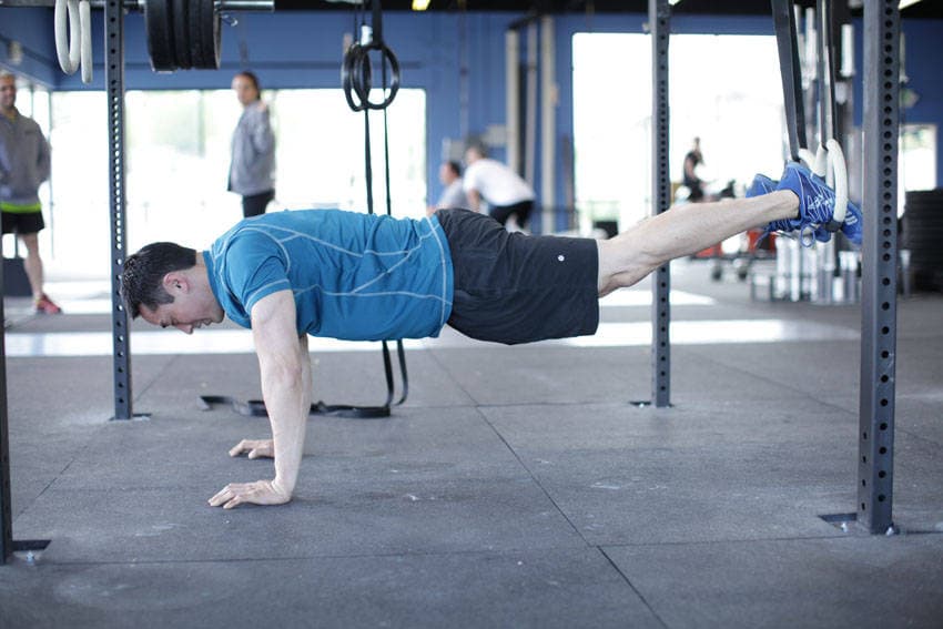 Suspended Reverse Crunch — starting position