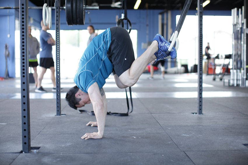 Suspended Reverse Crunch — end position