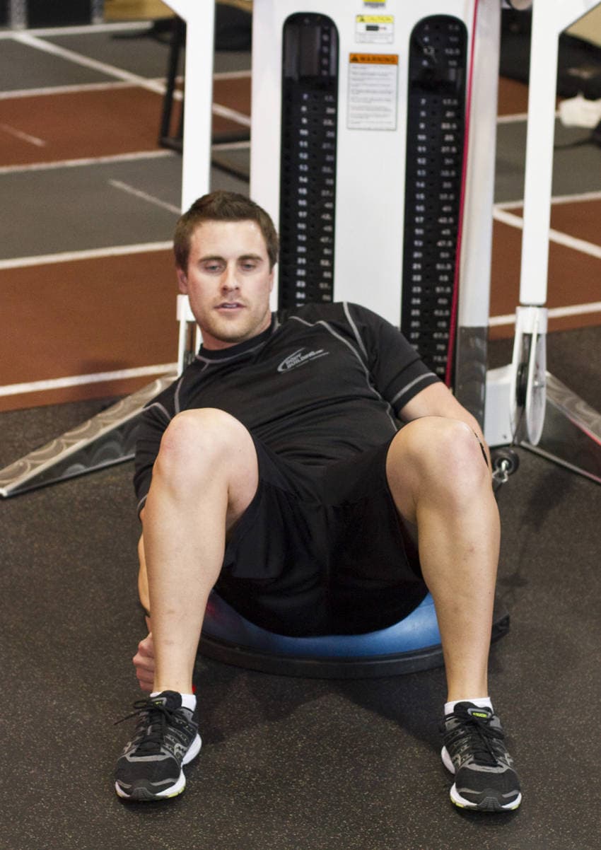 Bosu Ball Cable Crunch With Side Bends — end position