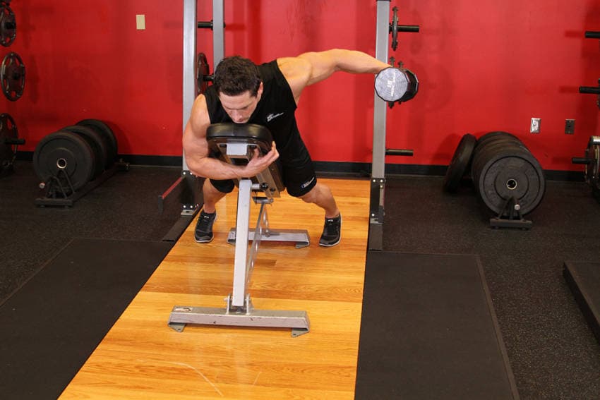 Dumbbell Lying One-Arm Rear Lateral Raise — end position