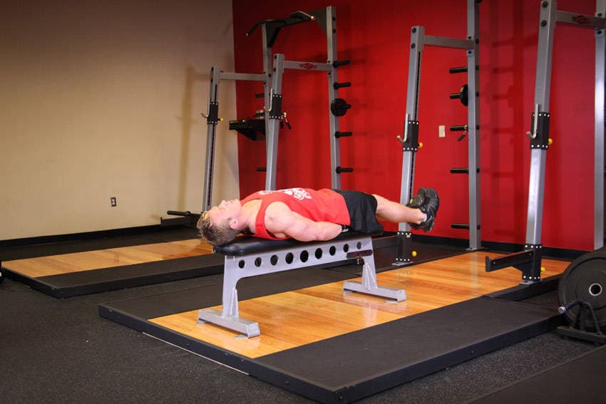Flat Bench Lying Leg Raise — starting position