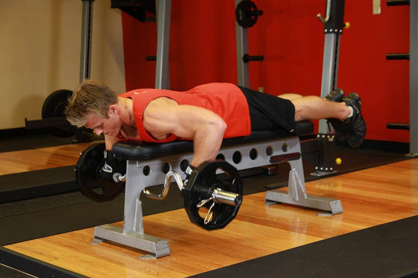 Lying Cambered Barbell Row — end position