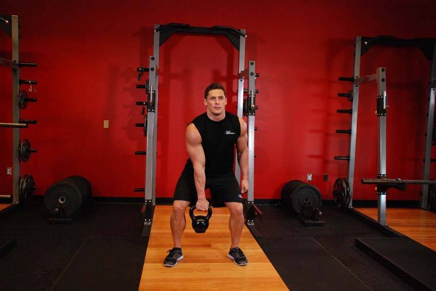 One-Arm Kettlebell Clean and Jerk — starting position