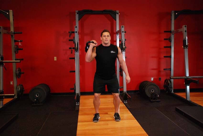 One-Arm Kettlebell Split Jerk — end position