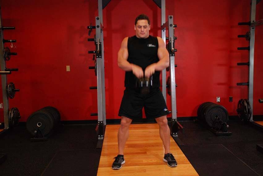 Open Palm Kettlebell Clean — end position