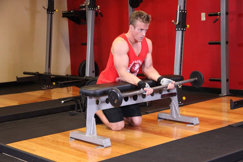 Palms-Up Barbell Wrist Curl Over A Bench — starting position