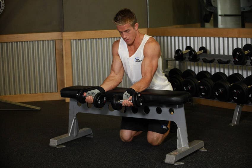 Palms-Up Dumbbell Wrist Curl Over A Bench — starting position