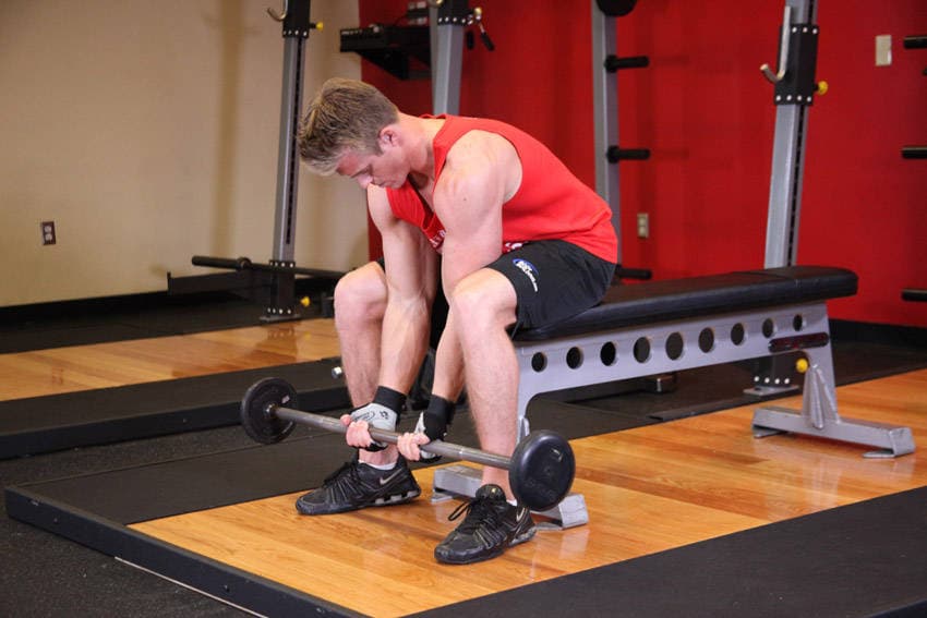 Seated Close-Grip Concentration Barbell Curl — starting position