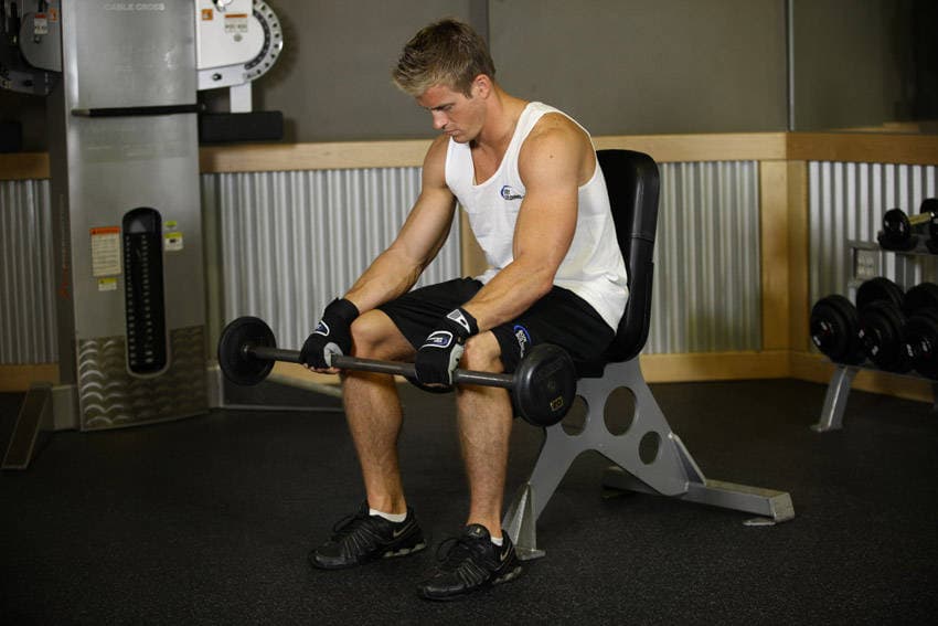 Seated Palms-Down Barbell Wrist Curl — starting position