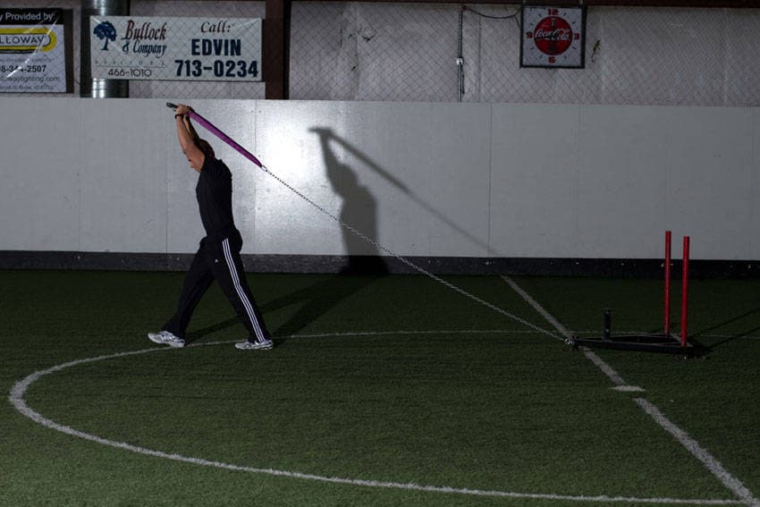 Sled Overhead Triceps Extension — end position