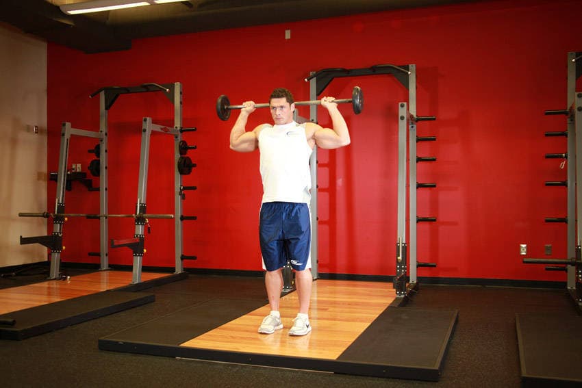 Standing Barbell Press Behind Neck — starting position