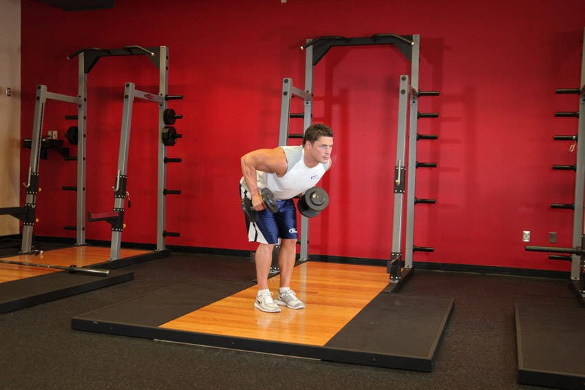 Standing Bent-Over Two-Arm Dumbbell Triceps Extension — starting position