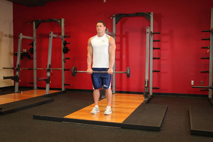 Standing Front Barbell Raise Over Head — starting position