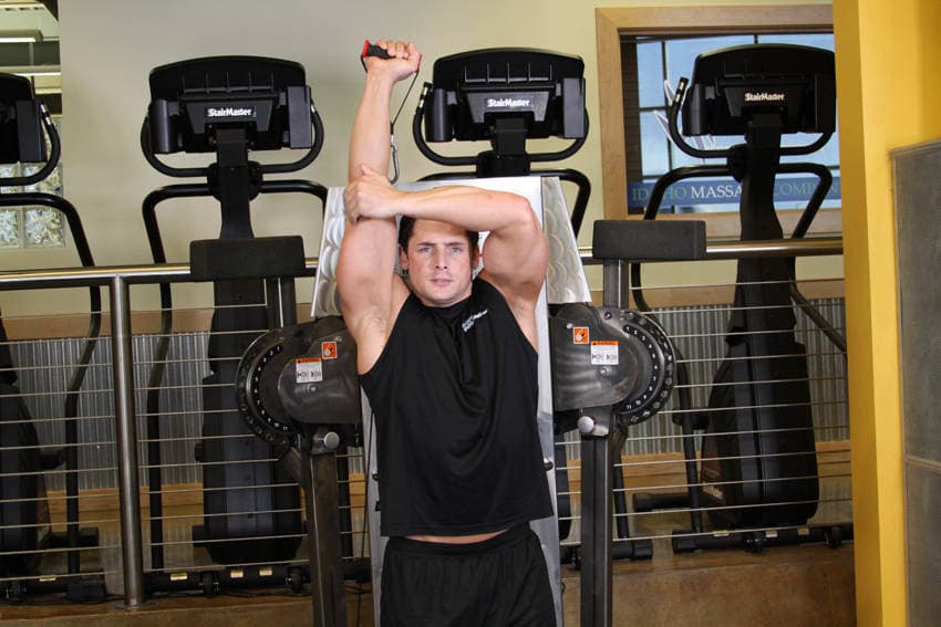 Standing Low-Pulley One-Arm Triceps Extension — end position