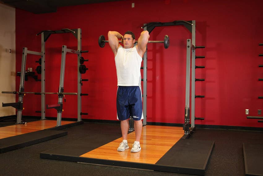 Standing Overhead Barbell Triceps Extension — starting position