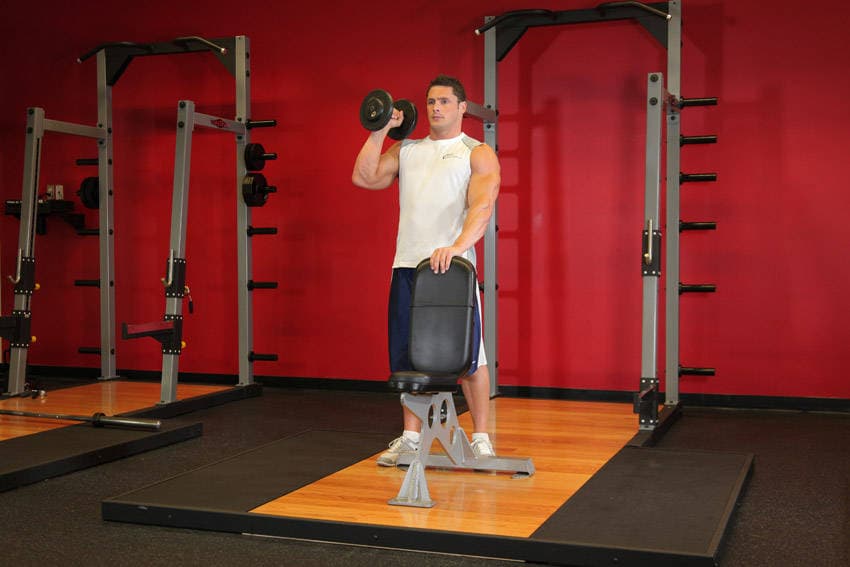 Standing Palm-In One-Arm Dumbbell Press — starting position