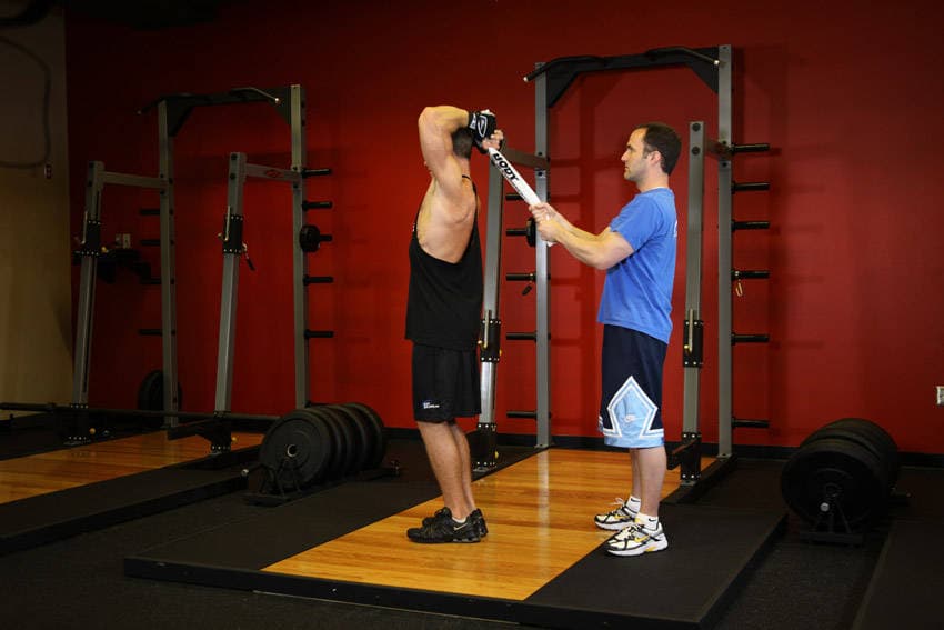 Standing Towel Triceps Extension — starting position