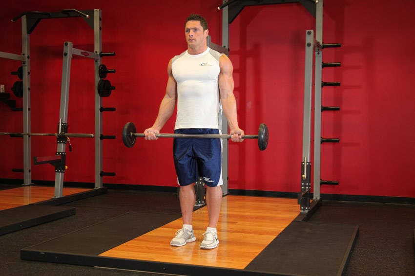 Wide-Grip Standing Barbell Curl — starting position
